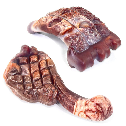 Two brown dog chew toys on a white background